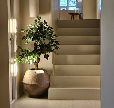 Skap høststemning med kunstige planter og dekor